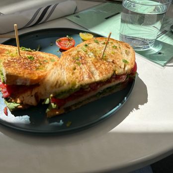Outpost Kitchen - Pesto Toasted Sandwich " Grilled chicken, walnut pesto, tomato chutney, arugula, country toast". - Breakfast & Brunch Near Me - Costa Mesa, California Outpost Kitchen - Pesto Toasted Sandwich " Grilled chicken, walnut pesto, tomato chutney, arugula, country toast". - Breakfast & Brunch Near Me - Costa Mesa, California