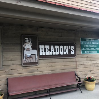 Headon & Sons - a bench in front of a building - Meat Shops Near Me - Creston, Illinois