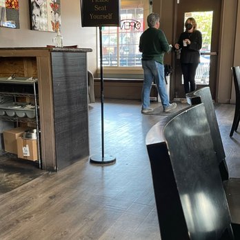 Serendipity Cafe and Lounge - a couple of people standing in front of the counter - Bakeries Near Me - Seattle, Washington Serendipity Cafe and Lounge - a couple of people standing in front of the counter - Bakeries Near Me - Seattle, Washington