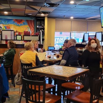 Border Cantina - a group of people sitting at a bar - Mexican Near Me - Novi, Michigan
