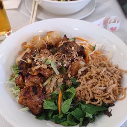 Bun with pork, spring rolls, and shredded pork