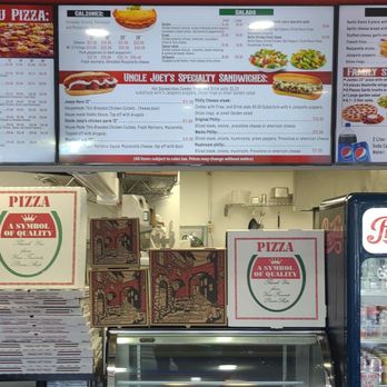 Uncle Joey's Pizza & Grill - Menu screens above the service counter - Pizza Near Me - La Mesa, California Uncle Joey's Pizza & Grill - Menu screens above the service counter - Pizza Near Me - La Mesa, California