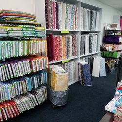Quilts Plus - Lots of fabric