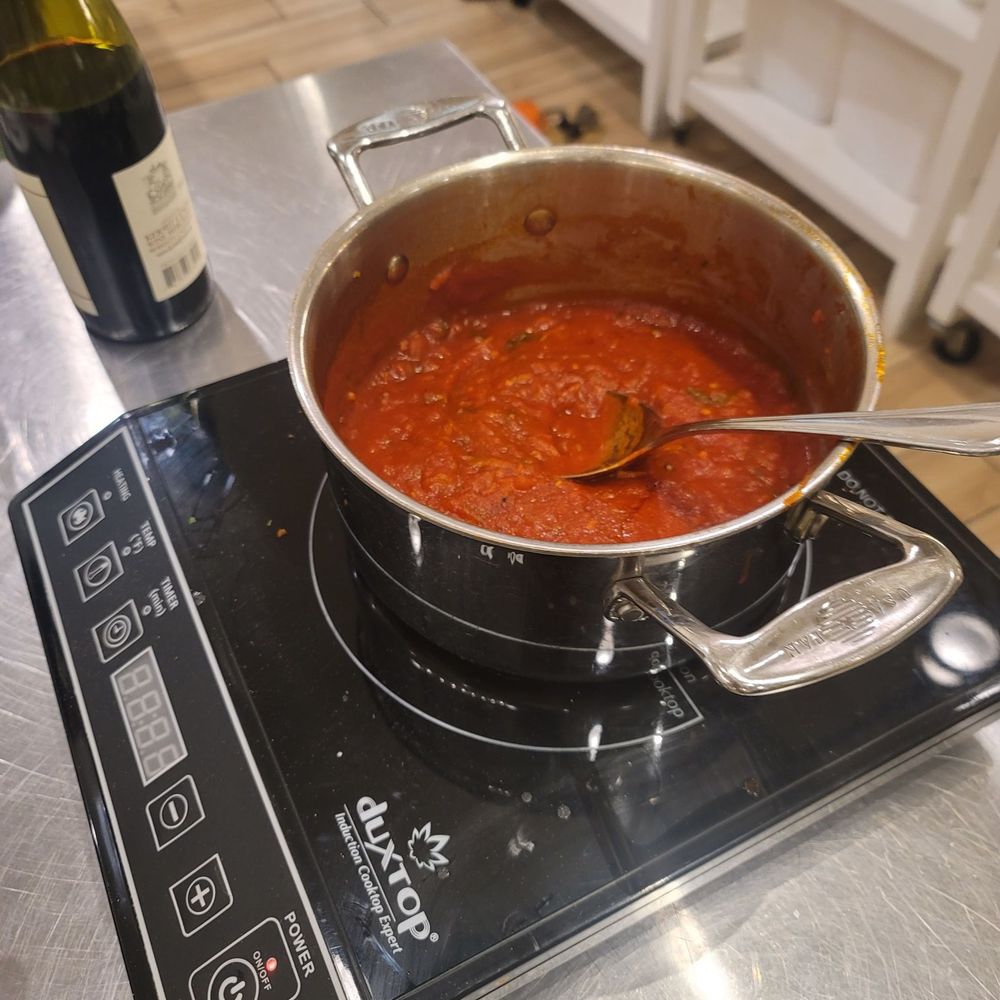 Taste Buds Kitchen - Cooking the sauce. - Team Building Activities Near Me - San Jose, California Taste Buds Kitchen - Cooking the sauce. - Team Building Activities Near Me - San Jose, California