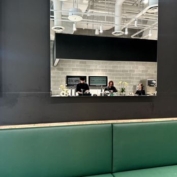 Matcha Matcha - two people sitting at a counter - Themed Cafes Near Me - Toronto, Ontario