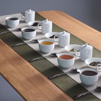 Gong Cha - a long table with cups of tea - Bubble Tea Near Me - Washington, DC, District of Columbia