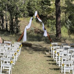 Mountain Meadows Cabins - Ceremony setup in the pasture below the main house deck. We also had a burlap and lace runner that wasn't placed yet.