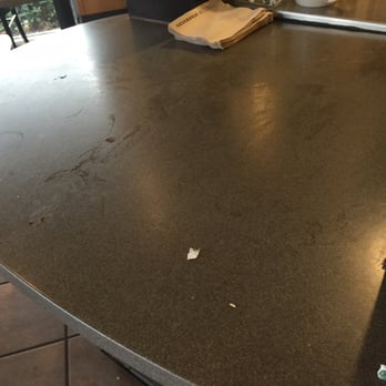 Starbucks - Counter where they hand you the drink. It was sticky. - Coffee & Tea Near Me - Stockton, California