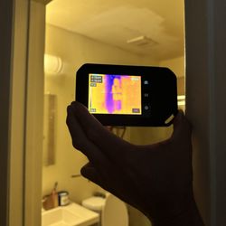 AquaPros Restoration - Wet bathroom per camera