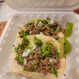 Asada tacos with cilantro and onion with handmade tortillas Asada tacos with cilantro and onion with handmade tortillas