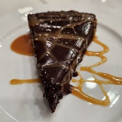 The Joyful Gourmet - Flourless Chocolate cake with bourbon. Carmel sauce