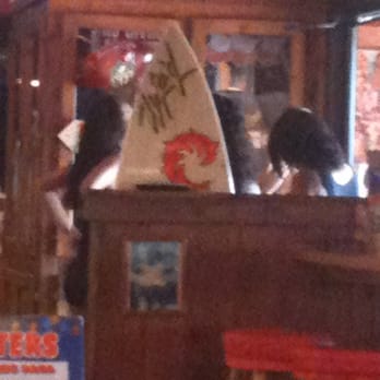 Hooters - And when they don't actually have to do things (like serve food) they all congregate by the front door. - American Near Me - Richmond, Virginia