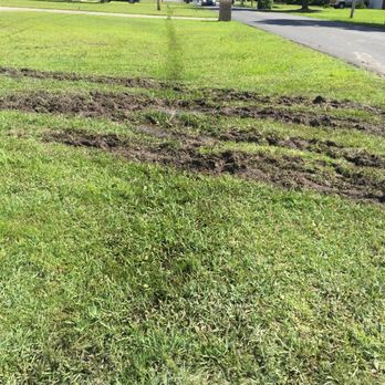 Concrete Masters - Up close look at the deep ruts caused by driving the concrete truck through our yard. - Masonry/Concrete Near Me Concrete Masters - Up close look at the deep ruts caused by driving the concrete truck through our yard. - Masonry/Concrete Near Me