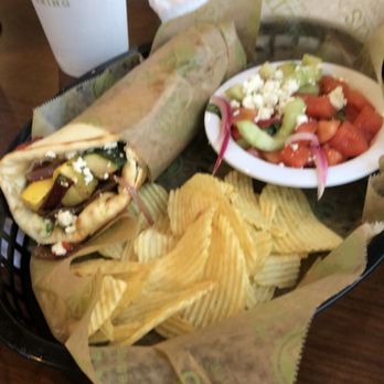 Taziki's Mediterranean Cafe - Bartlett - Grilled Veggie Gyro with tomato-cucumber salad and chips. Delicious!! - Mediterranean Near Me - Memphis, Tennessee