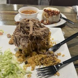 Mofongo/yellow rice and pork. Side order of white rice and beans. Also, had their sweet plantains. Mofongo/yellow rice and pork. Side order of white rice and beans. Also, had their sweet plantains.