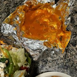 Mano's Pizza - Foil filled with Buffalo sauce