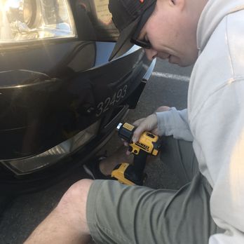 Napa Sign Shop - Heat gun ' removing tcp sticker's - Signmaking Near Me - Napa, California Napa Sign Shop - Heat gun ' removing tcp sticker's - Signmaking Near Me - Napa, California