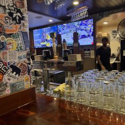 a bar with a lot of glasses on it a bar with a lot of glasses on it