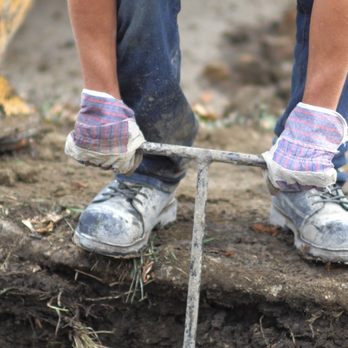 Lavenders Contracting Ltd - a close up of a person's feet and feet as they dig a hole in the ground - General Contractors Near Me - Edmonton, Alberta Lavenders Contracting Ltd - a close up of a person's feet and feet as they dig a hole in the ground - General Contractors Near Me - Edmonton, Alberta