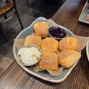 First Watch - Honey Butter Biscuit Bites Mini buttermilk biscuits with sugar salted honey butter and warm mixed berry compote. - Breakfast & Brunch Near Me - N. Kansas City, Missouri First Watch - Honey Butter Biscuit Bites Mini buttermilk biscuits with sugar salted honey butter and warm mixed berry compote. - Breakfast & Brunch Near Me - N. Kansas City, Missouri