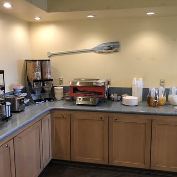 Blue Sail Inn - Breakfast bar with pastries, juices, fruit, hard boiled eggs, cereal and awesome instant pancake machine - Hotels Near Me - Morro Bay, California