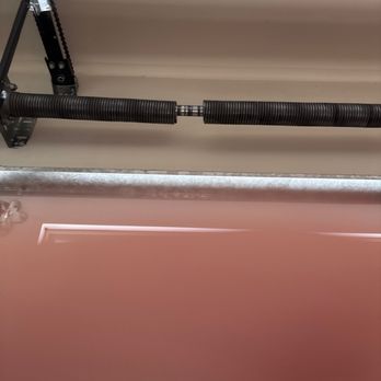 Next Level Garage Doors & Gates - Broken spring - closeup - Fences & Gates Near Me Next Level Garage Doors & Gates - Broken spring - closeup - Fences & Gates Near Me