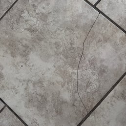 Broken tiles throughout