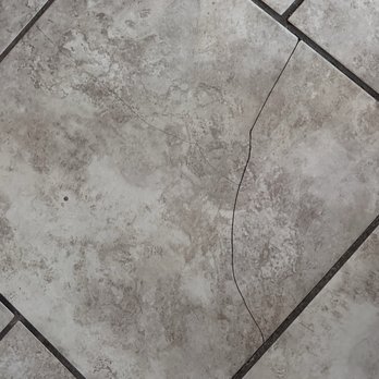 Invitation Homes - Broken tiles throughout - Property Management Near Me - Chandler, Arizona