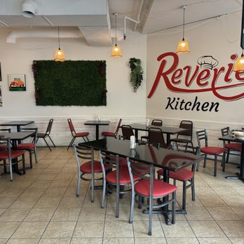 Reverie Kitchen - Seating area and logo on wall~ - Breakfast & Brunch Near Me - Burnaby, British Columbia