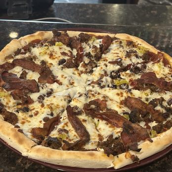 Minskys Pizza Cafe & Bar - Customized Prime Cut Pizza. I added pepperoncini, katamala olives, feta, and meatballs for a Greek kick! - Pizza Near Me - Lawrence, Kansas Minskys Pizza Cafe & Bar - Customized Prime Cut Pizza. I added pepperoncini, katamala olives, feta, and meatballs for a Greek kick! - Pizza Near Me - Lawrence, Kansas