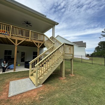 IMG Contractors - New deck stairs and pad enhance the usability and the look of a massive backyard area - General Contractors Near Me - Cumming, Georgia IMG Contractors - New deck stairs and pad enhance the usability and the look of a massive backyard area - General Contractors Near Me - Cumming, Georgia