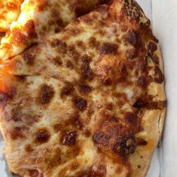 Toarmina's Pizza - Looks to be cooked but the cheese is not melted on
