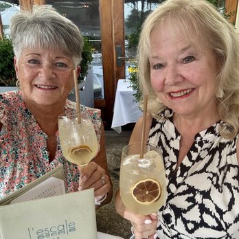 L'Escale - Outdoor patio overlooking water/boats enjoying Lemoncello Spritzers and bar menu tasties!! - French Near Me - Greenwich, Connecticut L'Escale - Outdoor patio overlooking water/boats enjoying Lemoncello Spritzers and bar menu tasties!! - French Near Me - Greenwich, Connecticut