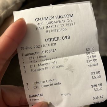 Chamoy - a person holding a receipt in their hand - Desserts Near Me - Haltom City, Texas