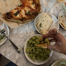 Pesto pasta and margarita pizza with sourdough and vinaigrette