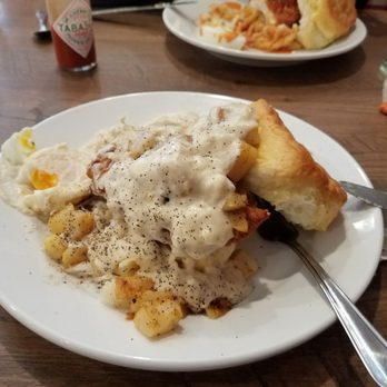 Frizzle Chicken Cafe - Country fried steak biscuit in front & chicken biscuit behind was better - Breakfast & Brunch Near Me - Pigeon Forge, Tennessee Frizzle Chicken Cafe - Country fried steak biscuit in front & chicken biscuit behind was better - Breakfast & Brunch Near Me - Pigeon Forge, Tennessee