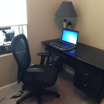 The Electrum Group - Near North Unit 204 desk -- Glass surface, super nice for note-taking :) - Apartments Near Me