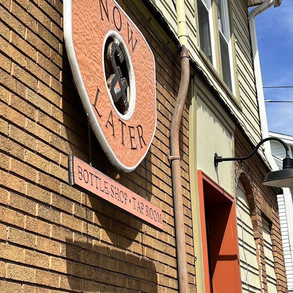 Now & Later - a sign on a brick building - Beer, Wine & Spirits Near Me - Syracuse, New York Now & Later - a sign on a brick building - Beer, Wine & Spirits Near Me - Syracuse, New York