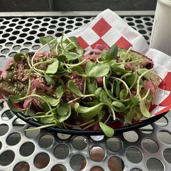 The Picnic Basket - Avocado Toast: Whole wheat bread, avocado, pickled onion, sprouts, sunflower seeds, and sesame seeds. You get 3 pieces of toast. - Breakfast & Brunch Near Me - Santa Cruz, California