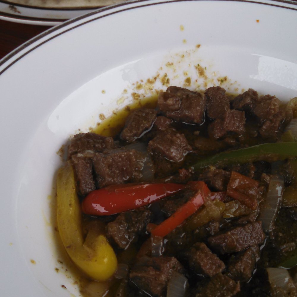Fatima's Cafe - Anjero (goat stew) with soft flat bread - delicious and out-of-the-ordinary - African Near Me - Worcester, Massachusetts