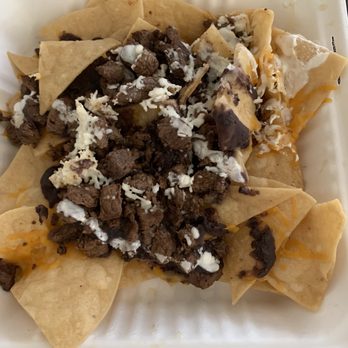 Spanglish Kitchen - Carne asada nachos. Guess I have to add my own queso fresco, sour cream, and shredded cheese at home. - Mexican Near Me - Alhambra, California