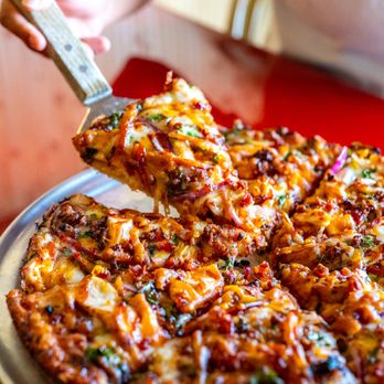 Coconut Kenny's Pizza - Burlington - Zesty Polynesian Sauce, Chicken, Pineapple, Red & Green Onions, Tomatoes & Crispy Bacon. - New American Near Me - Burlington, Washington Coconut Kenny's Pizza - Burlington - Zesty Polynesian Sauce, Chicken, Pineapple, Red & Green Onions, Tomatoes & Crispy Bacon. - New American Near Me - Burlington, Washington