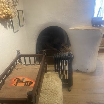 Kit Carson House and Museum - View of kitchen fireplace and crib - Children's Museums Near Me - Taos, New Mexico
