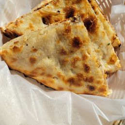 Peshwari Naan with coconut and bits of dried fruit.