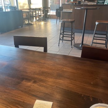 Starbucks - a table with a cup of coffee on it - Coffee & Tea Near Me - Calgary, Alberta Starbucks - a table with a cup of coffee on it - Coffee & Tea Near Me - Calgary, Alberta