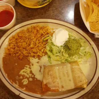 Carreta's Grill - Chimichanga with refried beans, rice, guacamole and sour cream. - Mexican Near Me - Slidell, Louisiana