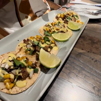 Thirty Acres Kitchen - Knott Your Average Taco - grilled steak tacos on hybrid corn/flour tortillas, onions, cilantro, roasted corn and Baja crema - Burgers Near Me - Buena Park, California Thirty Acres Kitchen - Knott Your Average Taco - grilled steak tacos on hybrid corn/flour tortillas, onions, cilantro, roasted corn and Baja crema - Burgers Near Me - Buena Park, California