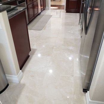 Tile Expo - a kitchen with a stainless steel refrigerator - Flooring Near Me - Anaheim, California