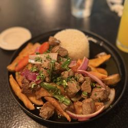 Lama Peruvian cuisine - Beef saltados with potato wedges