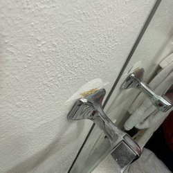 Ideal Beach Resort - Towel bars peeling off wall.